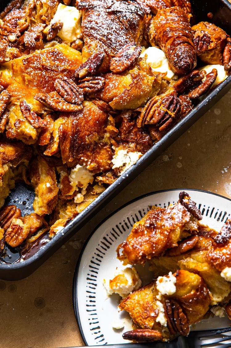 Maple pecan croissant French toast bake – a golden brown, nutty, sweet casserole-style breakfast dolloped with cream cheese and jam-packed with day-old butter croissants soaked in a cinnamon-cardamom-spiced custard batter.