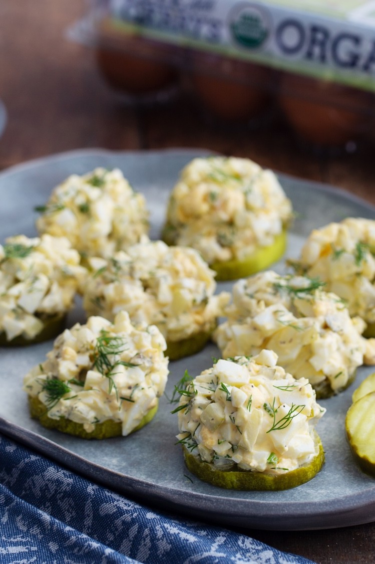 Keto dill pickle egg salad served on pickle slices and topped with fresh dill for a healthy, zesty, low carb snack. | peteandgerrys.com 