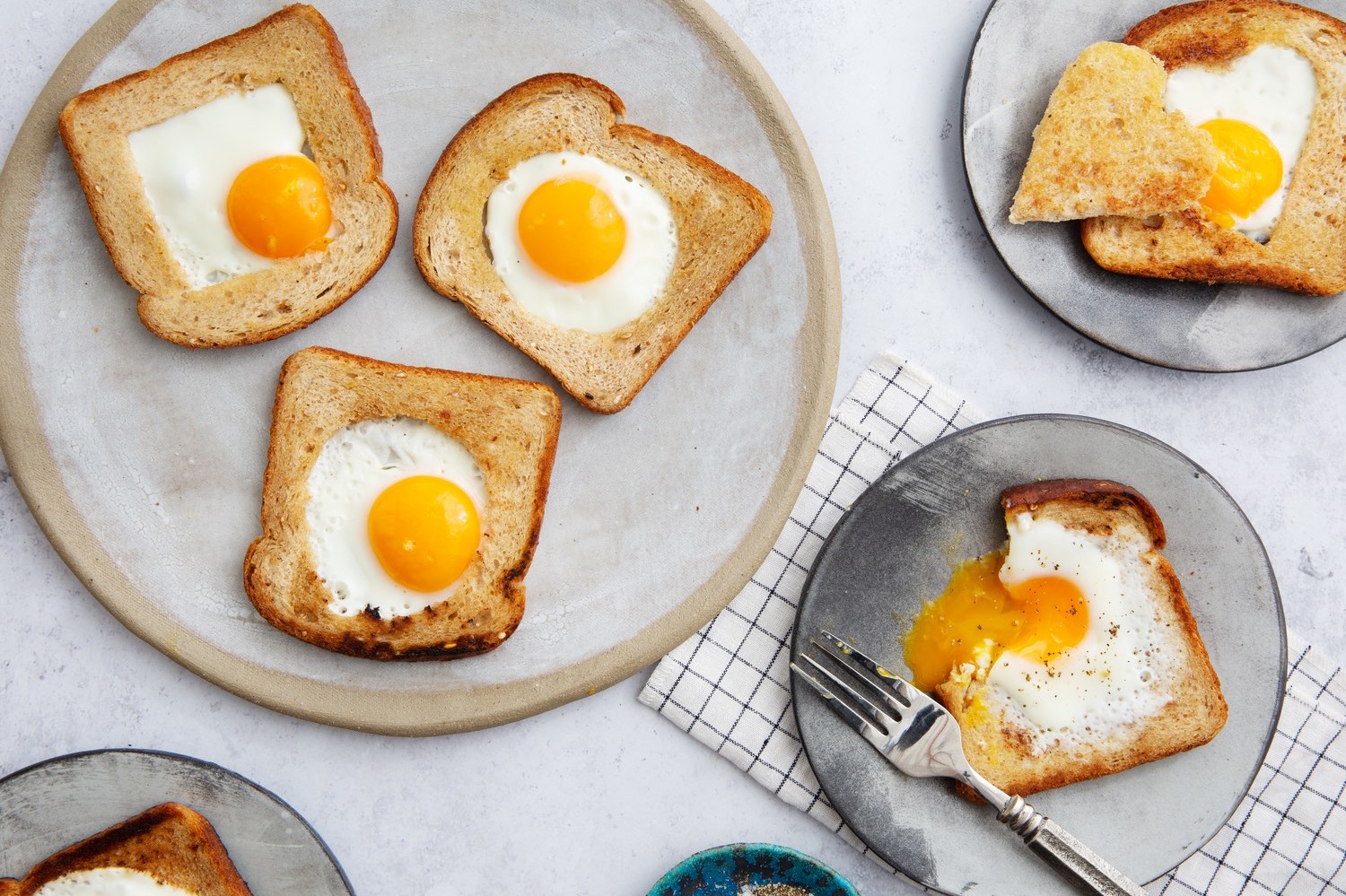 Egg in frame or toad in a hole, a simple breakfast consisting of toast with a hole cut out of the middle and an egg nestled and cooked inside. | peteandgerrys.com 