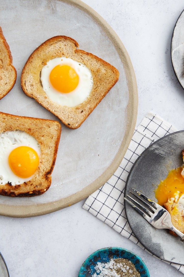 Egg in frame or toad in a hole, a simple breakfast consisting of toast with a hole cut out of the middle and an egg nestled and cooked inside. | peteandgerrys.com 