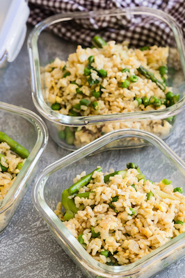 This egg fried rice can be served as lunch or a kid-friendly dinner side. This dish features fried brown rice, organic eggs, scallions, green peas, and asparagus. | peteandgerrys.com 