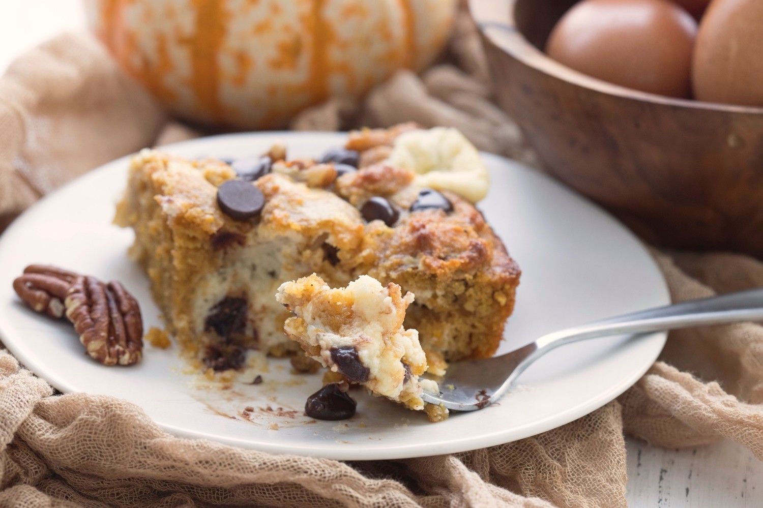 Keto pumpkin spice earthquake cake is a seismic mass of chocolatey goodness with pecan peaks and cream cheese fault lines in every single bite.