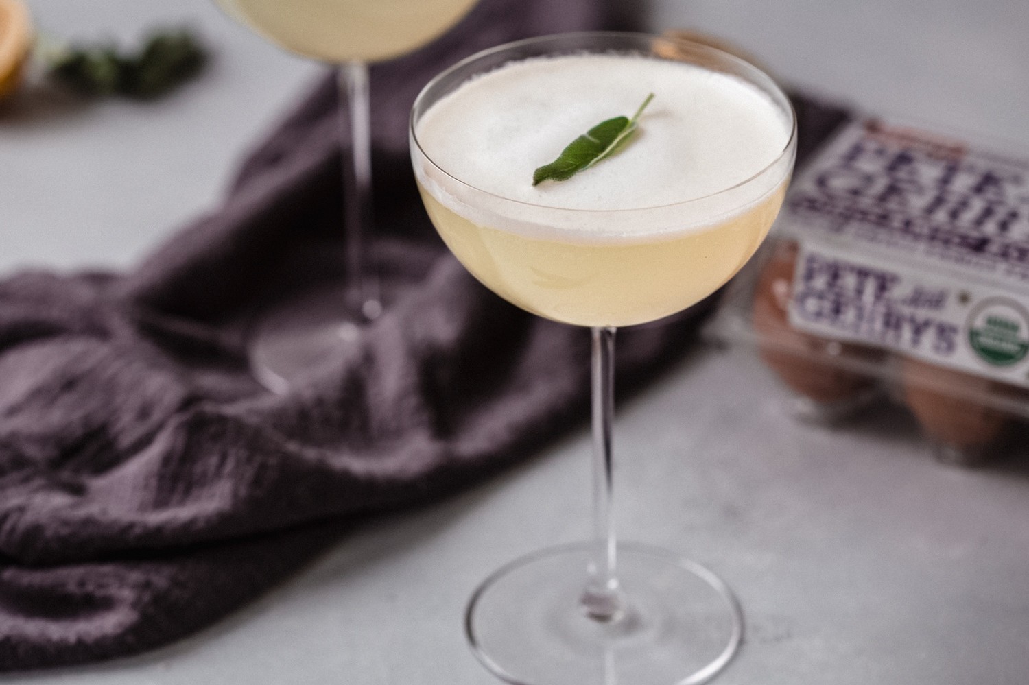 This light and lemony gin fizz packs some intense flavor thanks to two key ingredients: Meyer lemon and egg white. | peteandgerrys.com 