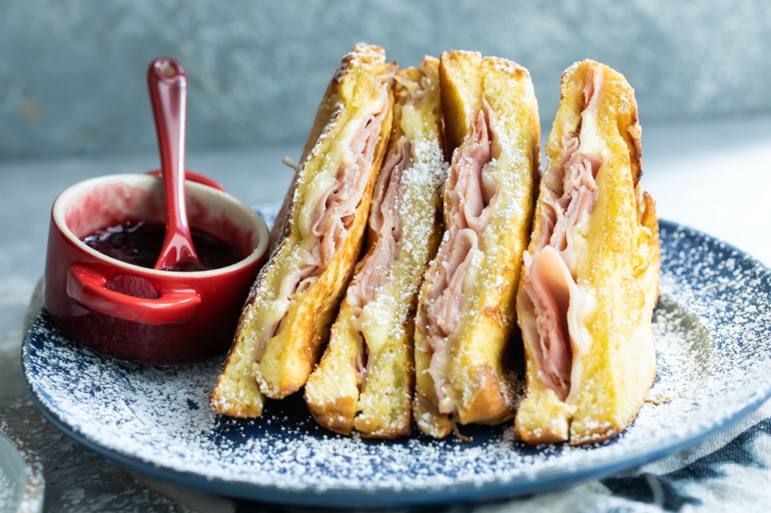 This skillet Monte Cristo sandwich features brioche bread, smoked ham, Gruyère cheese, and dijon mustard. Top your sandwich with confectionary sugar, jam, or mustard. | peteandgerrys.com 