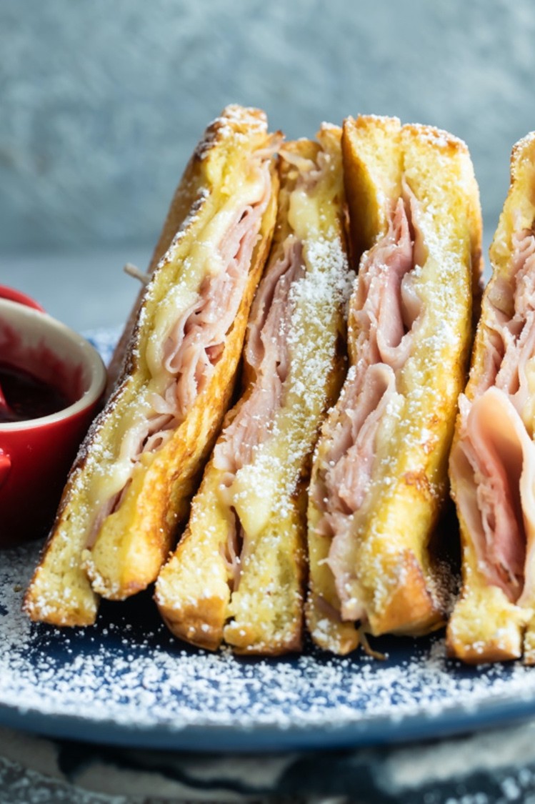 This skillet Monte Cristo sandwich features brioche bread, smoked ham, Gruyère cheese, and dijon mustard. Top your sandwich with confectionary sugar, jam, or mustard. | peteandgerrys.com 