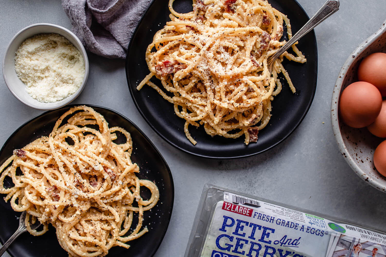 This pasta carbonara is a classic, thanks to the delicious and rich, egg-based sauce. We topped our pasta with parmesan cheese, diced bacon, and fresh black pepper. | peteandgerrys.com 