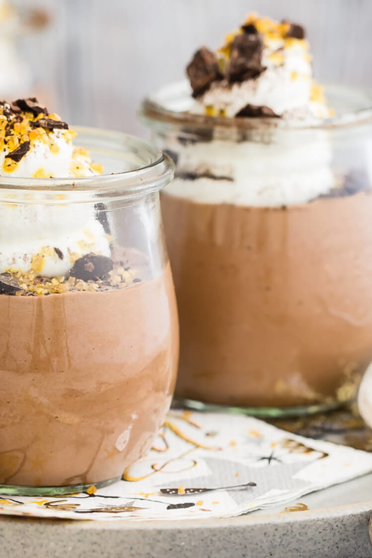 Recipe for classic chocolate mousse with a light, airy texture and a touch of brandy. Served in individual cups with with whipped cream, chocolate shavings, and gold sprinkles. | peteandgerrys.com 