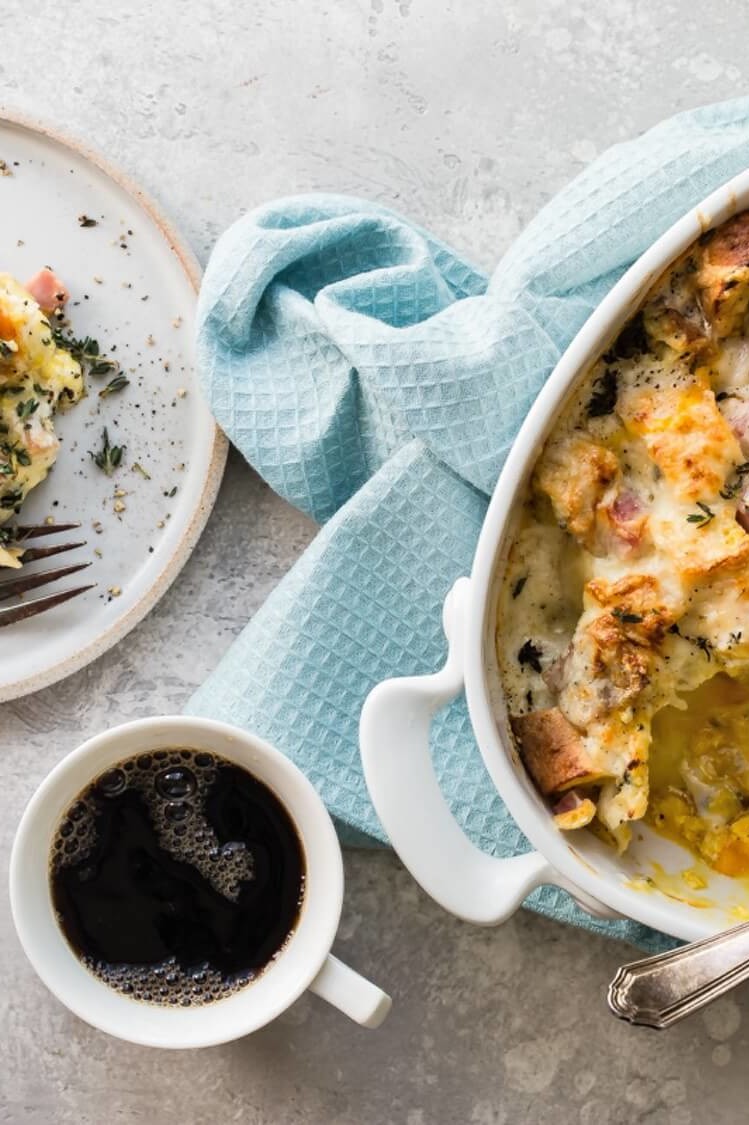 This crowd-friendly croque madame breakfast casserole features slices of crusty French bread coated in Gruyère cheese, ham, a delicious egg mixture, and béchamel sauce. | peteandgerrys.com