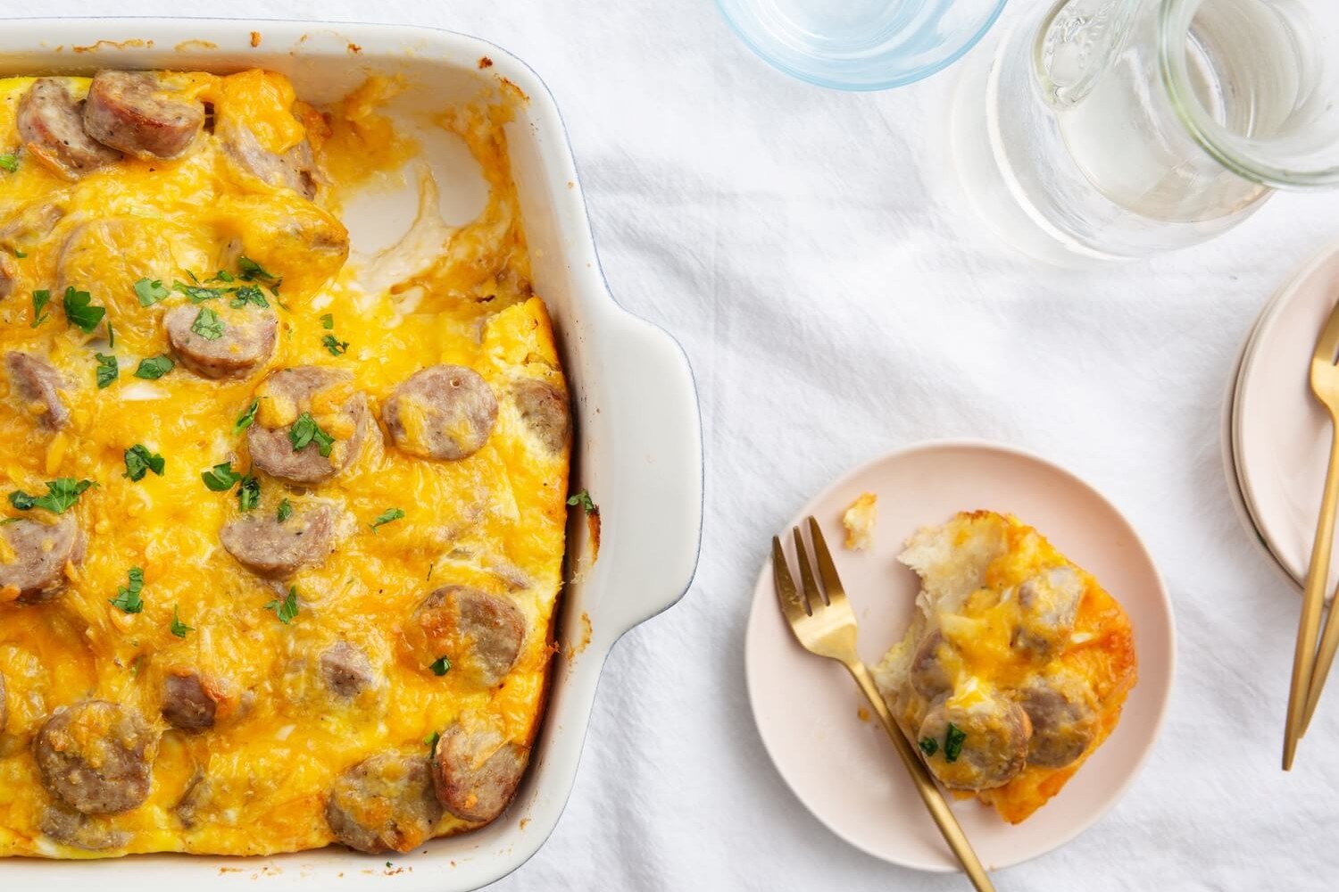 This breakfast casserole is a true family farm favorite. It features biscuits, sausage, cheddar cheese, and eggs. A filling meal for the family. | peteandgerrys.com