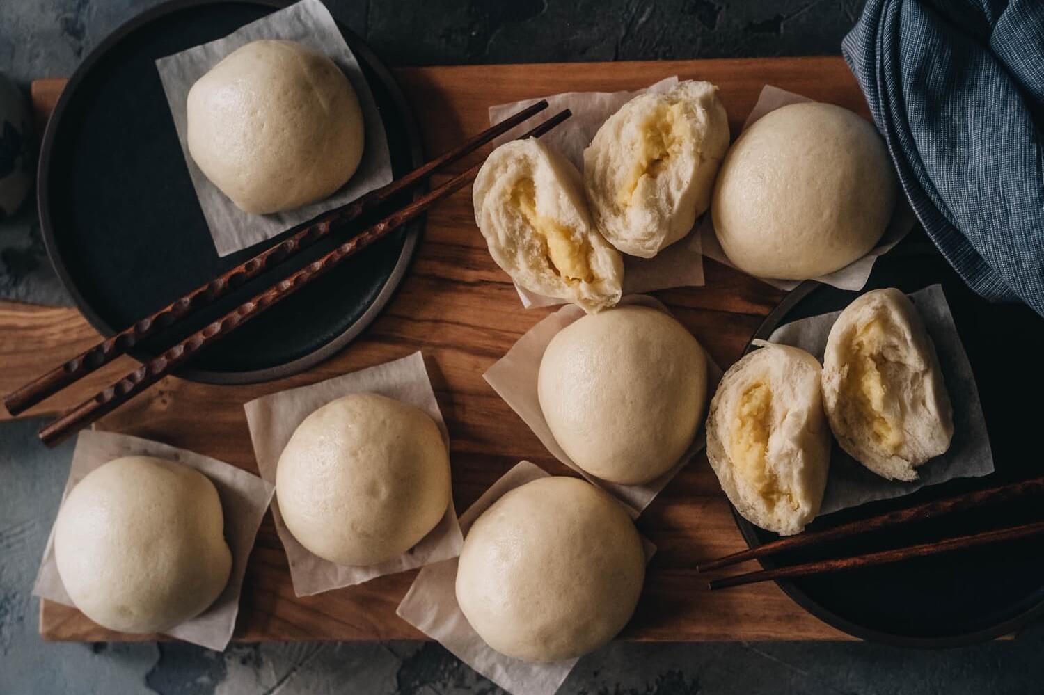 Pictured are fluffy and shiny, custard-filled buns. This recipe is made by Omnivore's Dilemma. Serve as dessert or alongside dinner. | peteandgerrys.com 