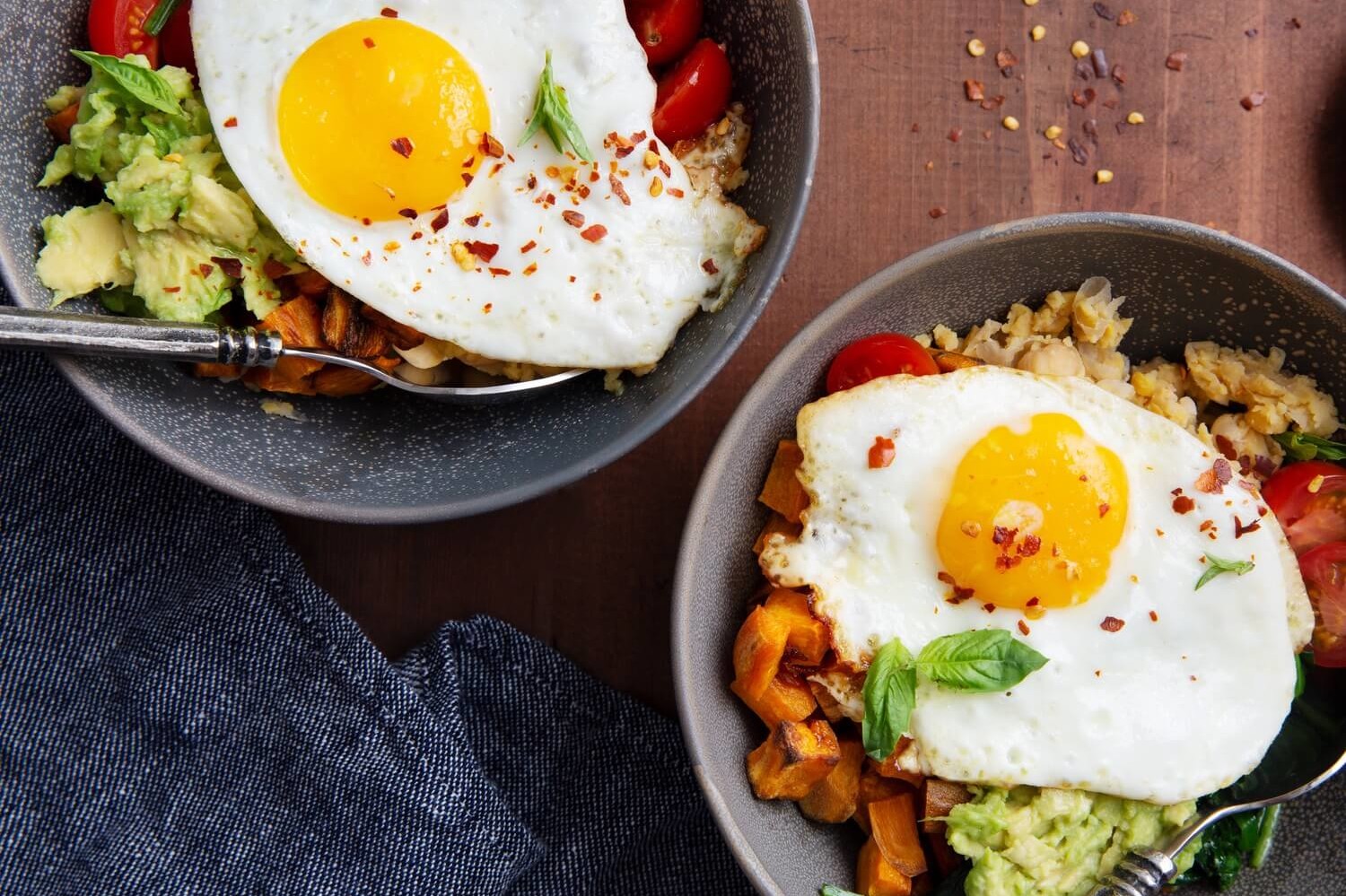 Delicious breakfast bowl featuring a tasty mix of mashed avocado, roasted sweet potato, chickpeas, baby spinach, and organic eggs. | peteandgerrys.com 