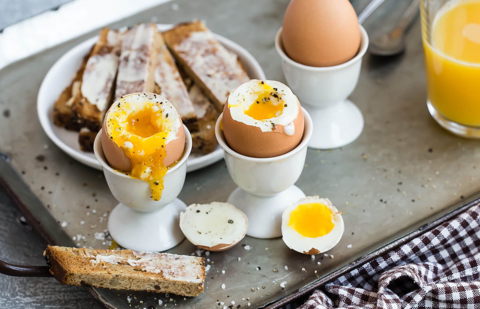 Eggs and soldiers, a dish that consists of generously buttered golden brown toast sticks and soft boiled eggs for dipping. | peteandgerrys.com