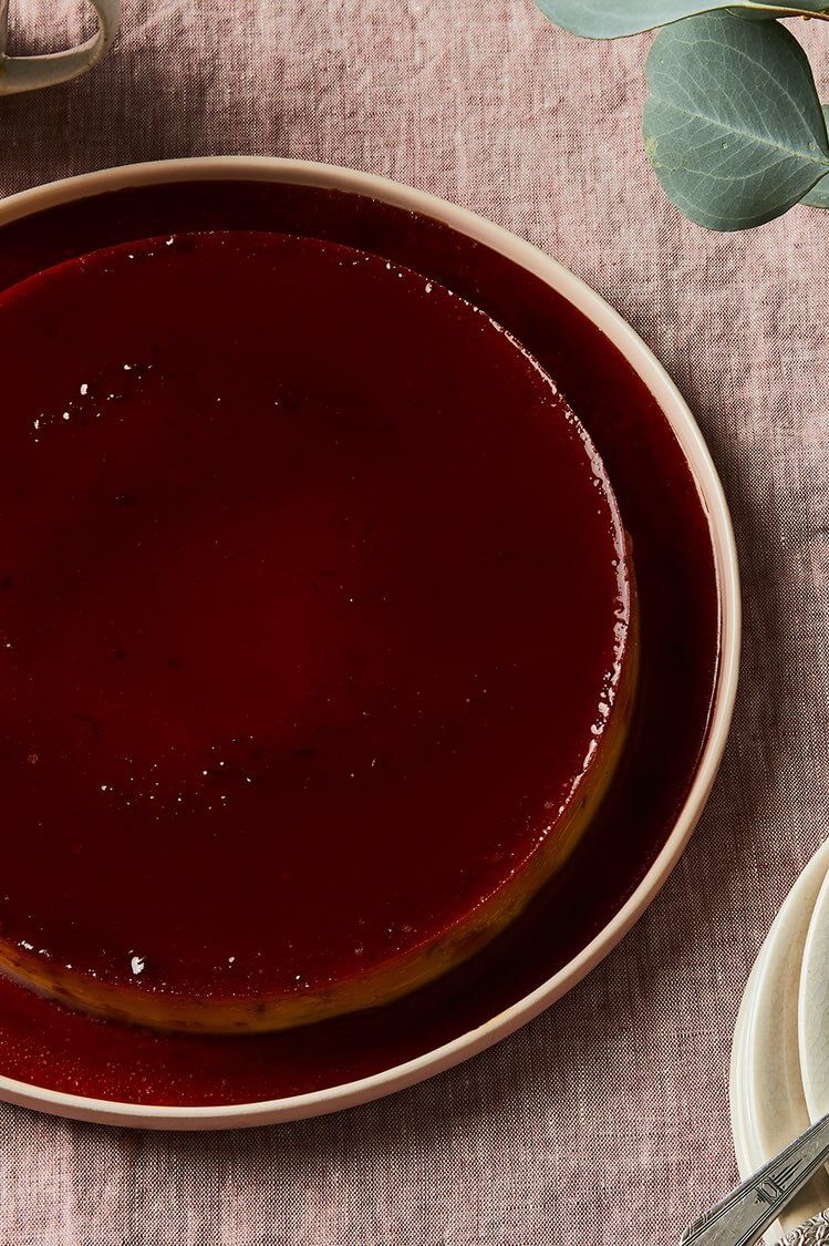 This tropical twist on a classic flan from Food52 is made with coconut milk, coconut cream, lime, and coconut flakes. Flan is shown with a dark caramel topping. | peteandgerrys.com