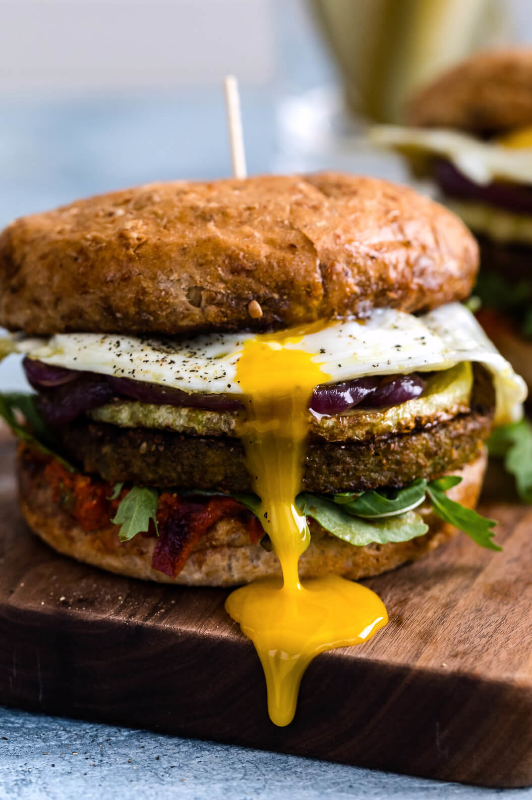 These loaded burgers are kid-friendly and vegetarian. These burgers start with your favorite veggie burgers, topped with a fried egg, and covered in pepper sauce. | peteandgerrys.com 