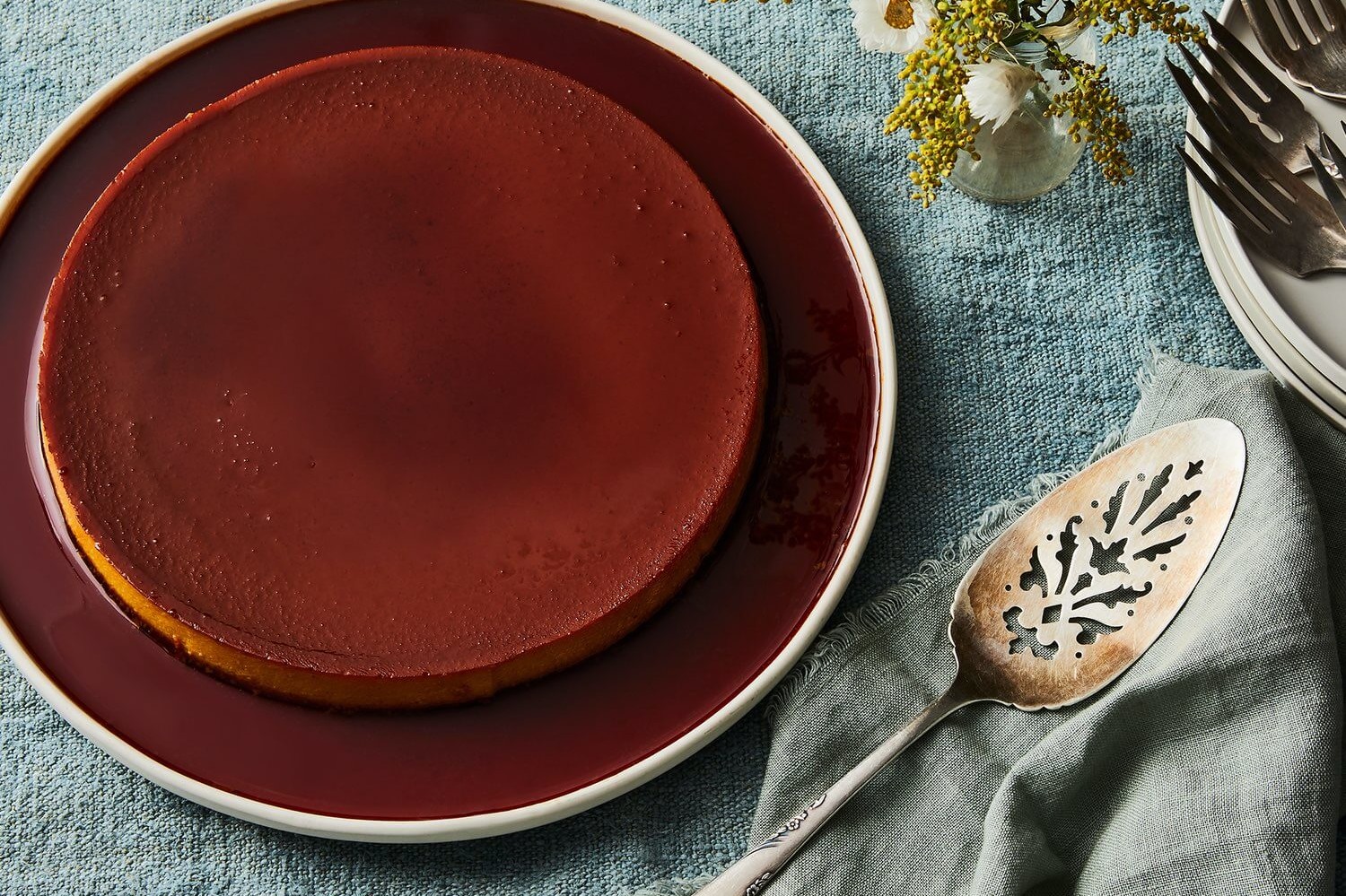 This golden milk flan is an easy dessert that you can make in advance. It features sweetened condensed milk and organic eggs. This flan has a perfect copper brown top because of the inclusion of cinnamon and turmeric. | peteandgerrys.com 