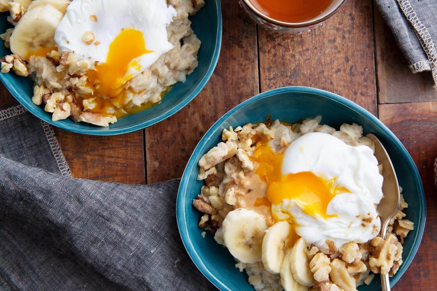 This Gwen Jorgensen creation fuels any breakfast. This dish features oats, bananas, peanut butter, walnuts, and poached organic eggs. | peteandgerrys.com