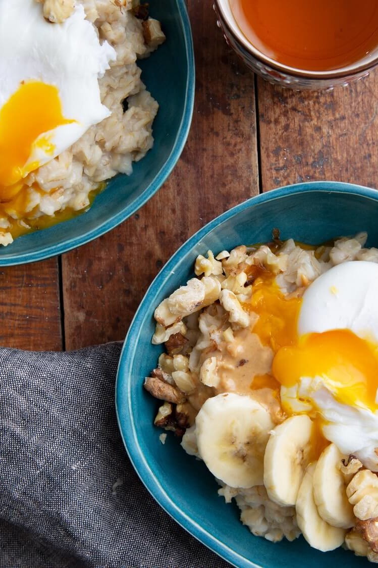 This Gwen Jorgensen creation fuels any breakfast. This dish features oats, bananas, peanut butter, walnuts, and poached organic eggs. | peteandgerrys.com