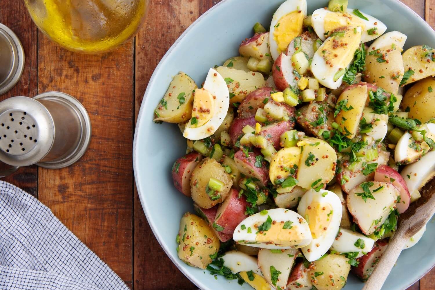 Mayonnaise free egg salad features red bliss potatoes, hard-boiled eggs, and a dijon mustard vinegarette. | peteandgerrys.com  