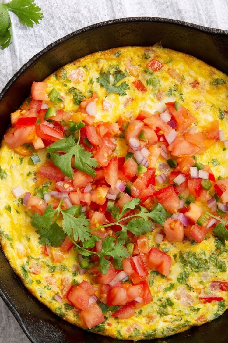 This Mexican frittata is made with bright orange organic eggs, jalapeño, cilantro, and fresh pico de Gallo. | peteandgerrys.com 