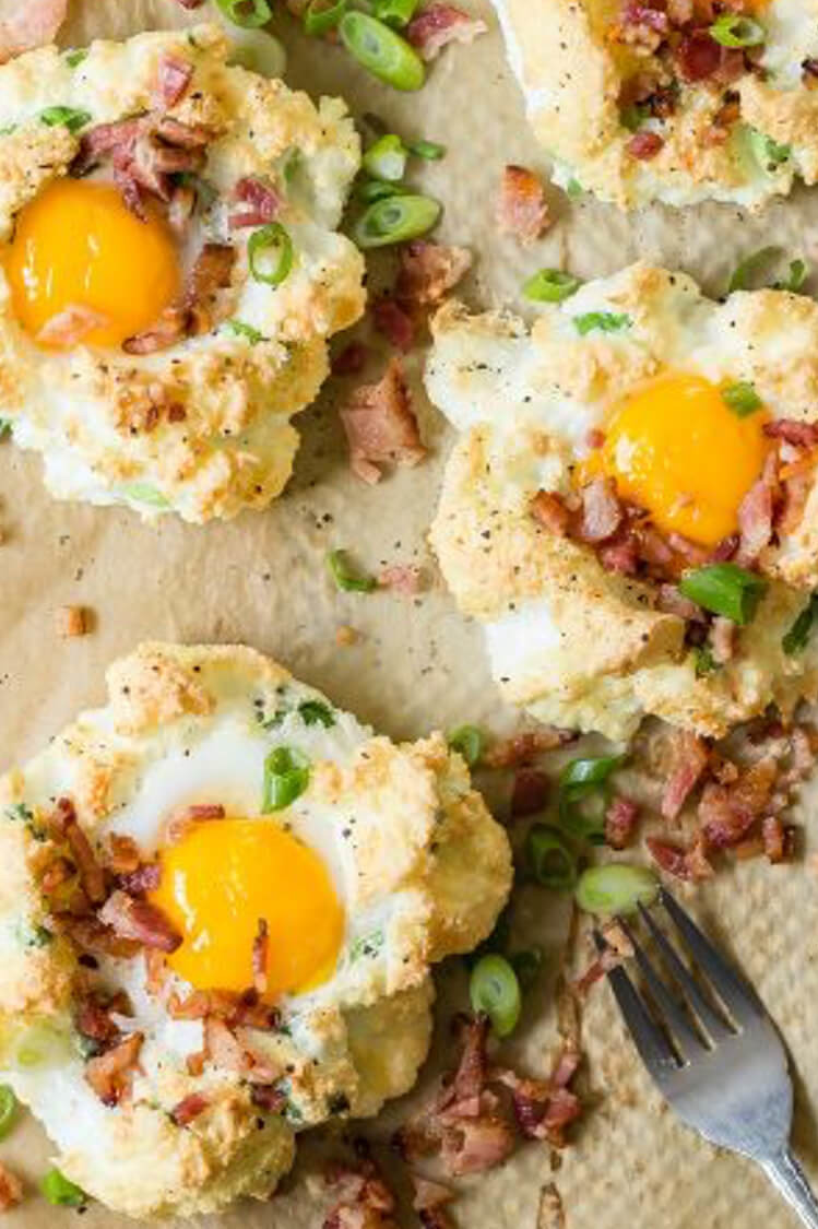 Cloud eggs flavored with Gruyère cheese, green onions, and bacon. Whipped egg whites are formed into nests on a baking sheet, then baked with yolks in the centers. | peteandgerrys.com 