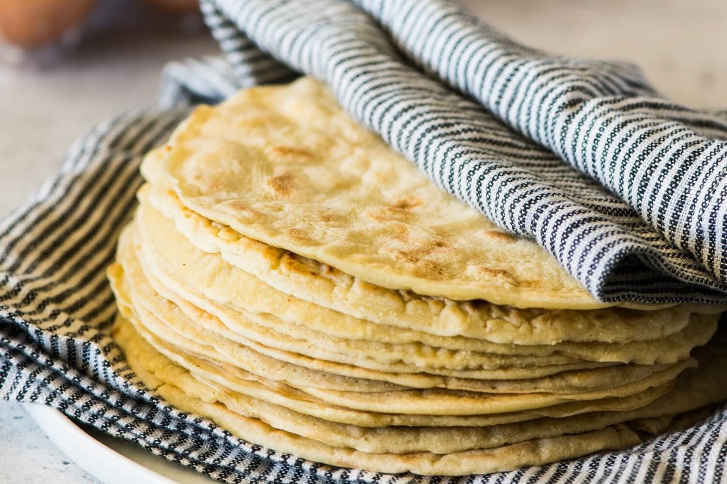 These paleo tortillas are made with coconut flour, tapioca, sea salt, almond milk, and organic brown eggs. | peteandgerrys.com 