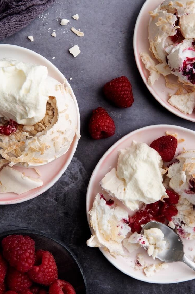 Pavlova snowballs made with a quick and easy meringue, topped with raspberries and sweetened shredded coconut. | peteandgerrys.com 