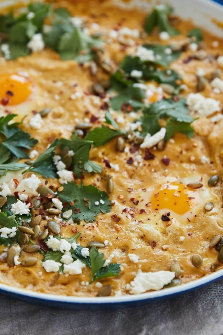 This pumpkin shakshuka is topped with queso fresco or feta cheese, and fresh parsley. This dish is perfect with fresh pita bread. | peteandgerrys.com 