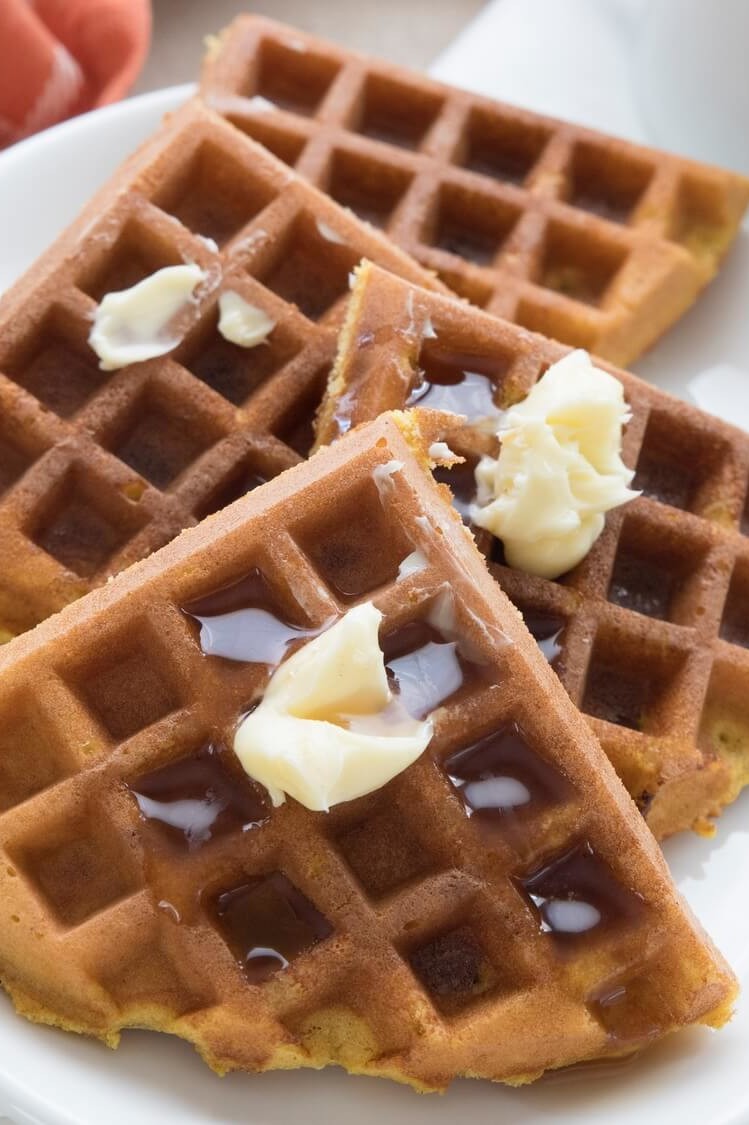 These keto-friendly pumpkin protein waffles are made with organic eggs, pumpkin puree, almond flour, and butter. Our waffles are topped with maple syrup and soft butter. | peteandgerrys.com 