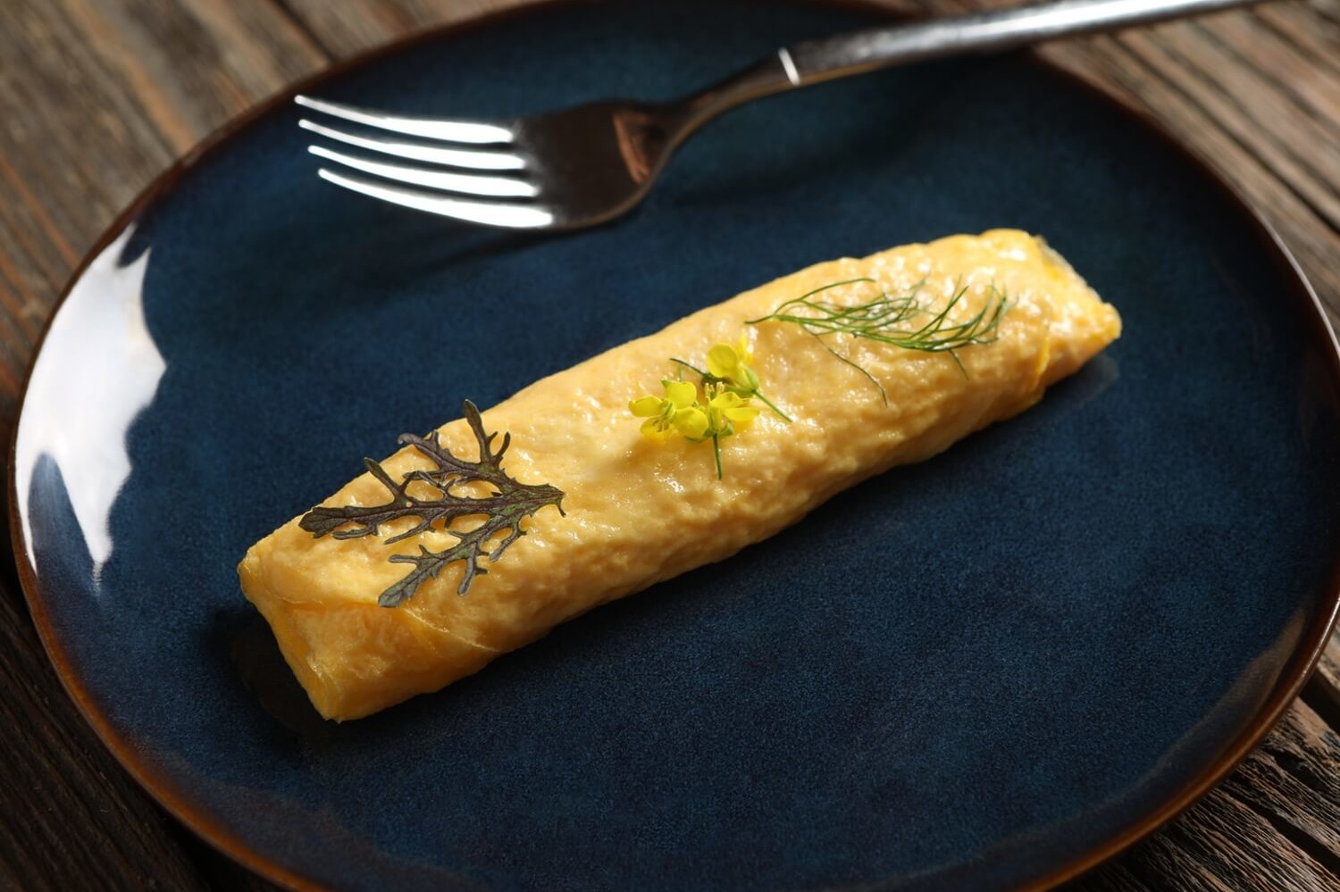 This Japanese rolled omelet or Tamagoyaki, is made with organic eggs, chicken stock, Nellie's butter, and fresh ground pepper. | peteandgerrys.com 