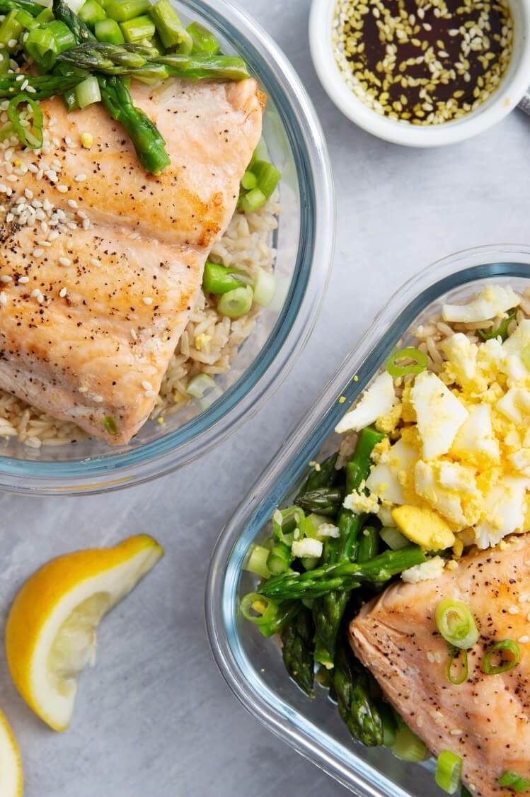 This zesty salmon bowl is based on brown rice, asparagus, scallions, crumbled organic eggs, and seared salmon. | peteandgerrys.com