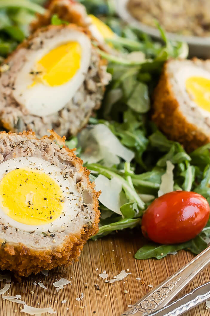 These scotch eggs are a perfect finger food for your next party. This recipe features organic hard-boiled eggs encased in a crunchy mixture of ground pork and panko breadcrumbs and fried to perfection. | peteandgerrys.com 