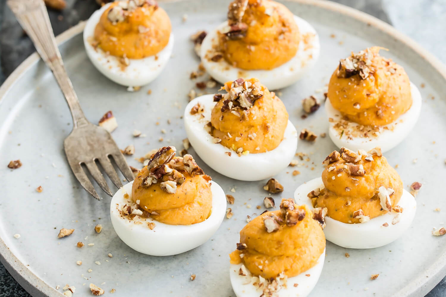 These deviled eggs are made with a fall twist. Pictured is our sweet potato deviled eggs which are made with mascarpone cheese, sweet potatoes, pecans, and brown sugar. | peteandgerrys.com 