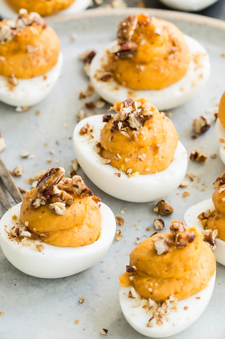 These deviled eggs are made with a fall twist. Pictured is our sweet potato deviled eggs which are made with mascarpone cheese, sweet potatoes, pecans, and brown sugar. | peteandgerrys.com 