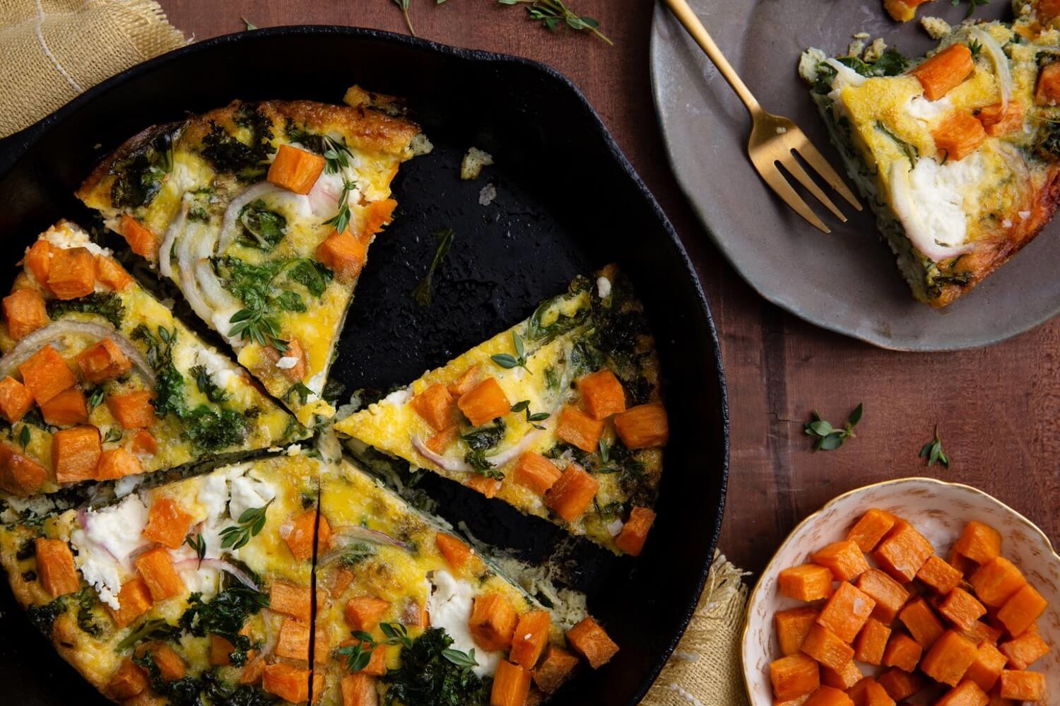 This roasted sweet potato and kale frittata offer a sweet kick to a traditionally savory classic. Our frittata is topped with fresh goat cheese and fresh thyme. | peteandgerrys.com 