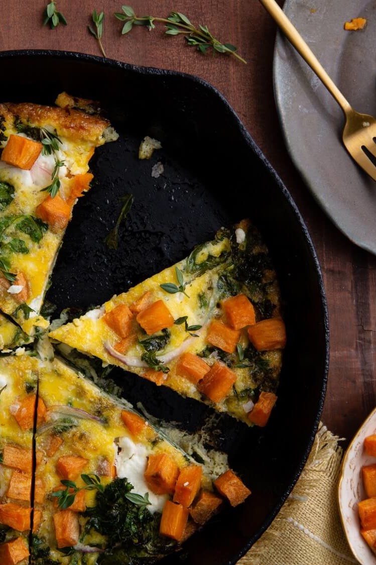 This roasted sweet potato and kale frittata offer a sweet kick to a traditionally savory classic. Our frittata is topped with fresh goat cheese and fresh thyme. | peteandgerrys.com 