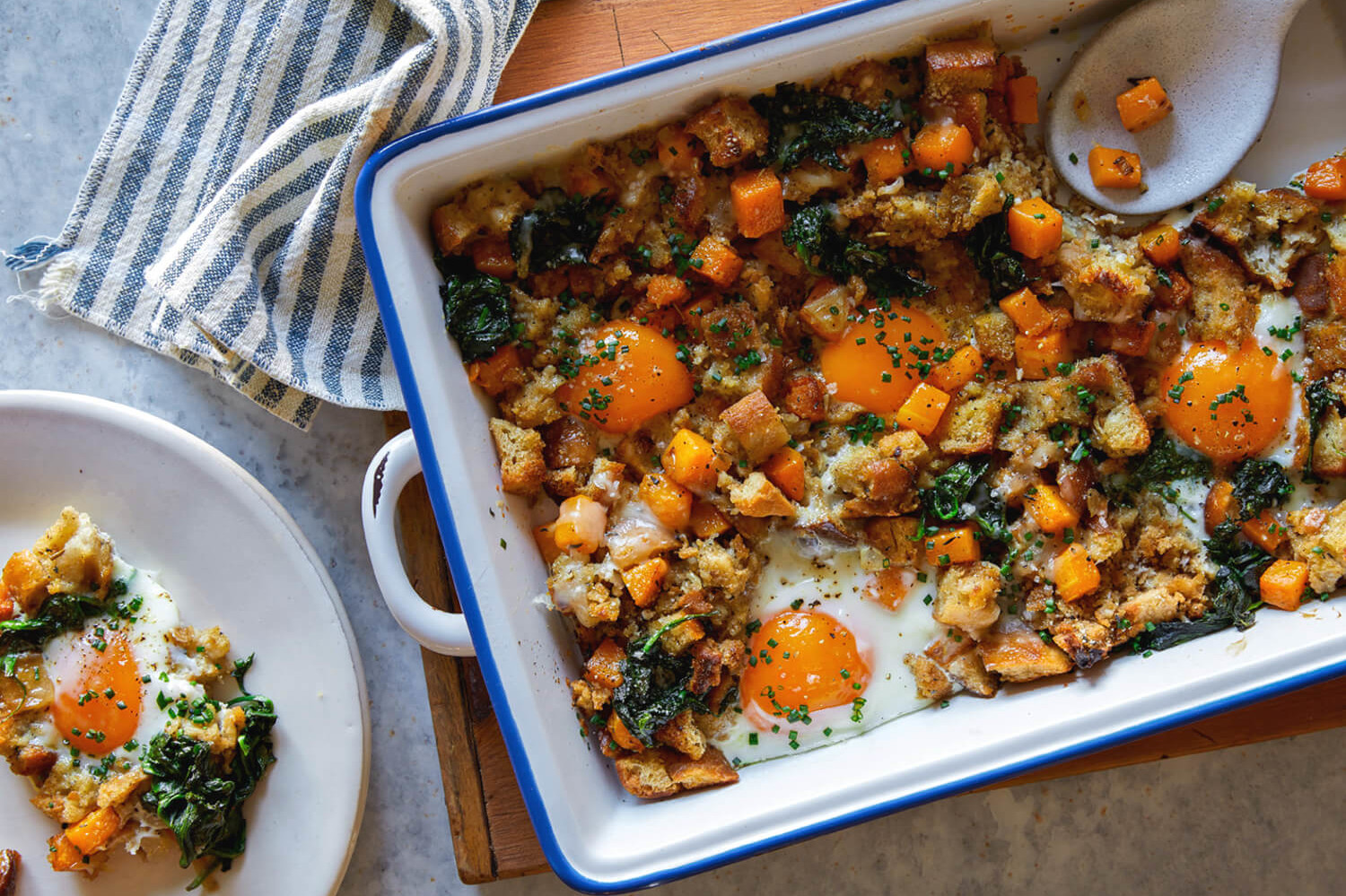 This Thanksgiving leftover hash is a mix of stuffing, swiss cheese, sautéed spinach, fresh herbs, and runny eggs. | peteandgerrys.com 