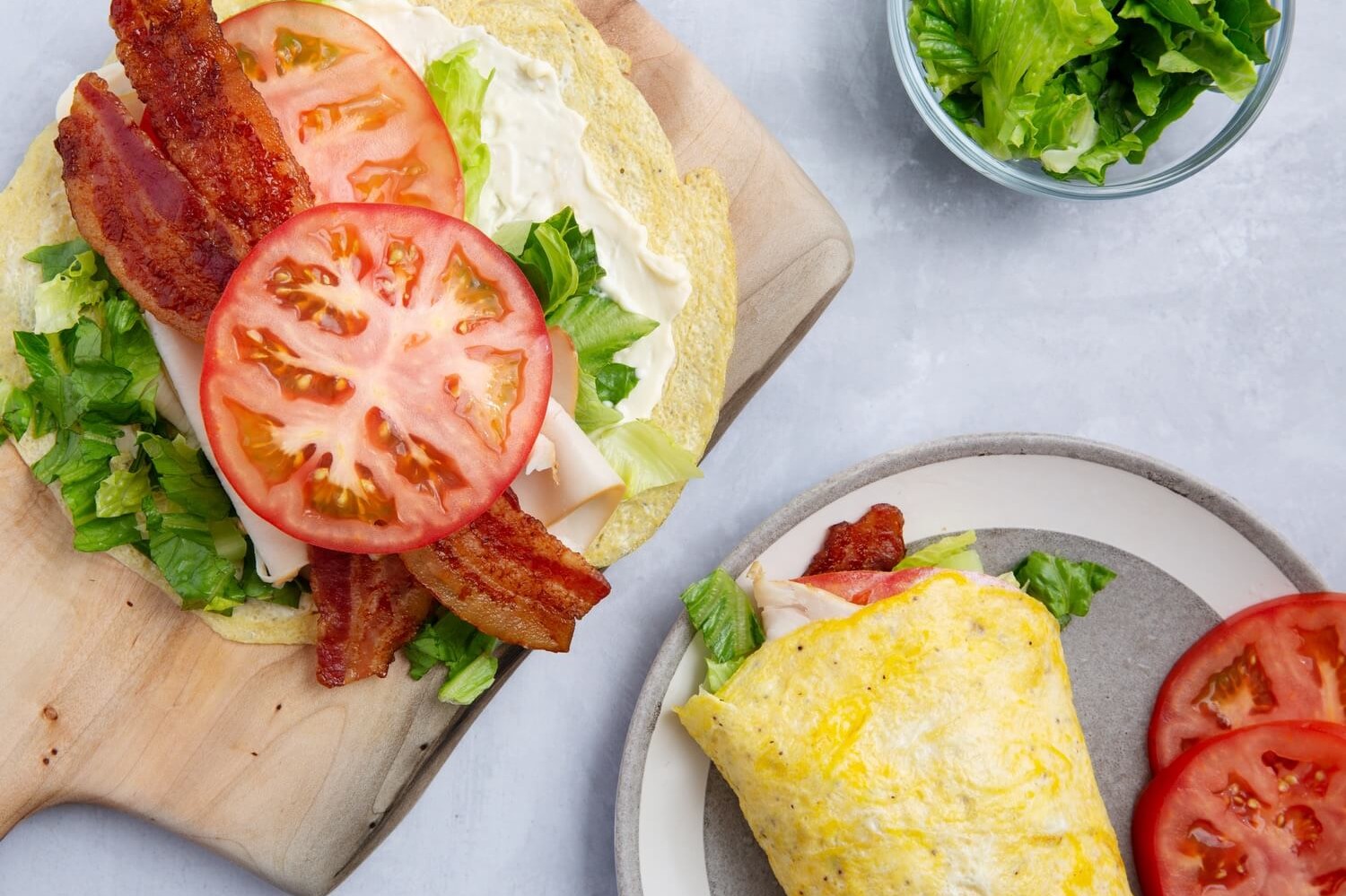 This keto turkey egg wrap is made with organic eggs and spices, and cooked on low until the eggs resemble a wrap. The wrap is filled with deli turkey, bacon, tomato, and lettuce. | peteandgerrys.com 