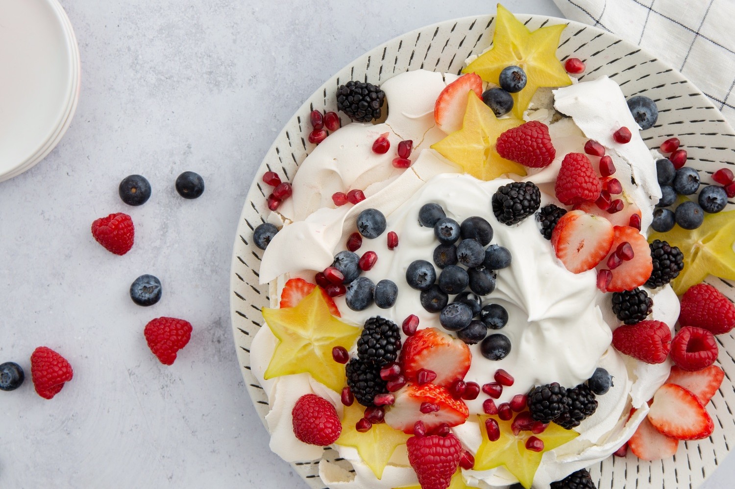 This pavlova is a great starter for any season dessert. The meringue is easy to whip up and the filling is superb. This recipe features organic egg whites, fresh fruit, and superfine sugar. | peteandgerrys.com 