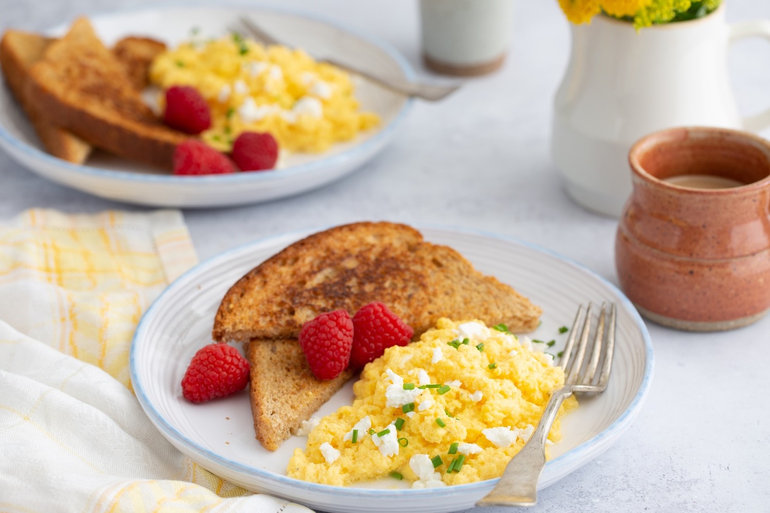 This is not your average scrambled eggs. Our scrambled eggs are mixed with a few dollops of plain yogurt, goat cheese, and fresh herbs. Then cooked to perfection. | peteandgerrys.com 