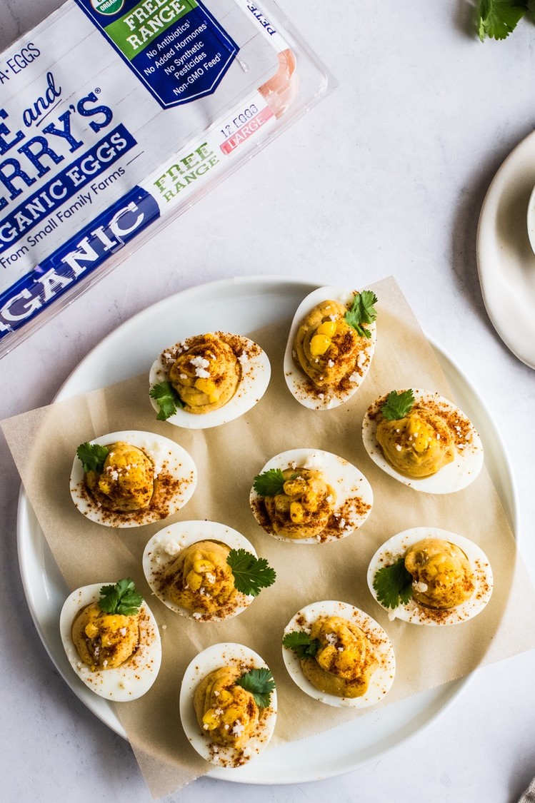 Mexican street corn inspired deviled eggs recipe made with cotija cheese, chili powder, and creamy mayonnaise. | peteandgerrys.com