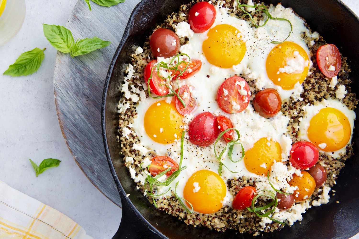 This summer skillet is filled with quinoa, heirloom tomatoes, basil, and feta cheese. Perfect as a summertime lunch or appetizer. | peteandgerrys.com 